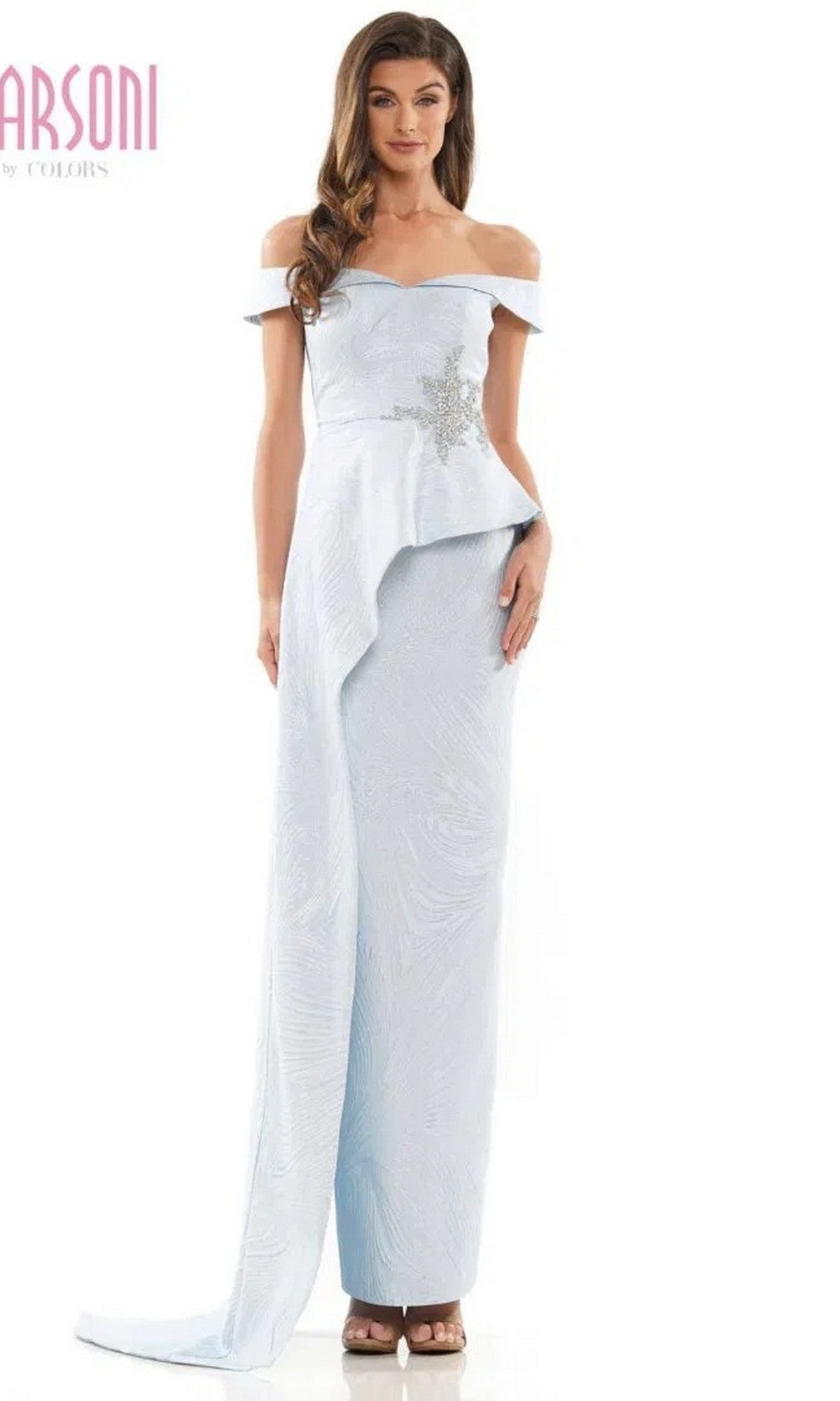 A woman wearing the Marsoni MV1225 long formal dress in sky blue, featuring jacquard fabric and off-shoulder sleeves.